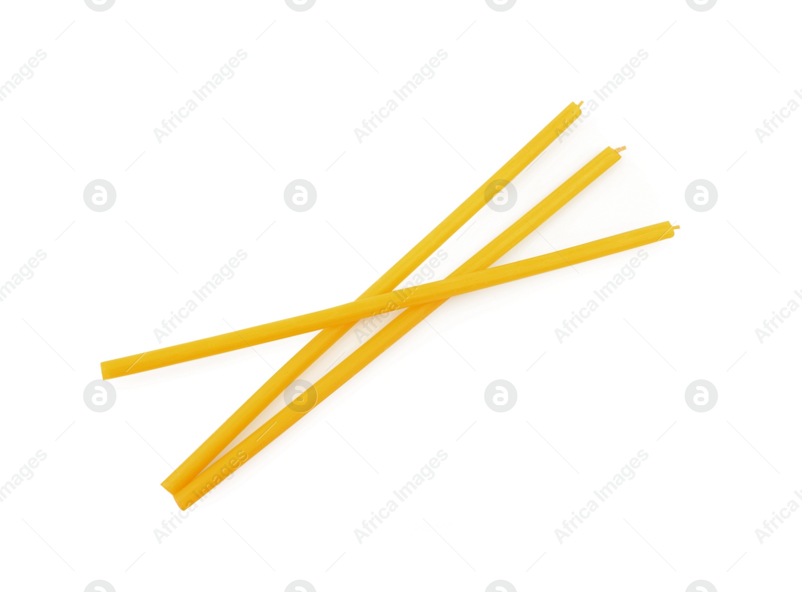 Photo of New church candles on white background, top view