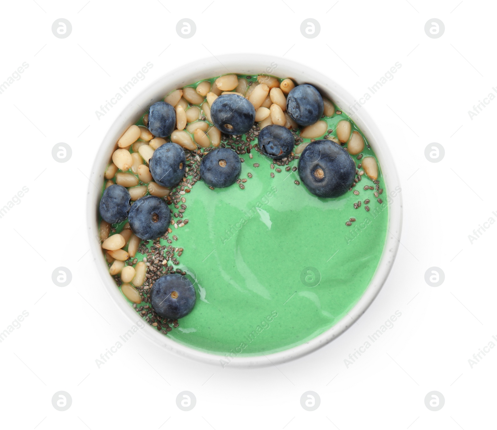 Photo of Bowl of spirulina smoothie isolated on white, top view