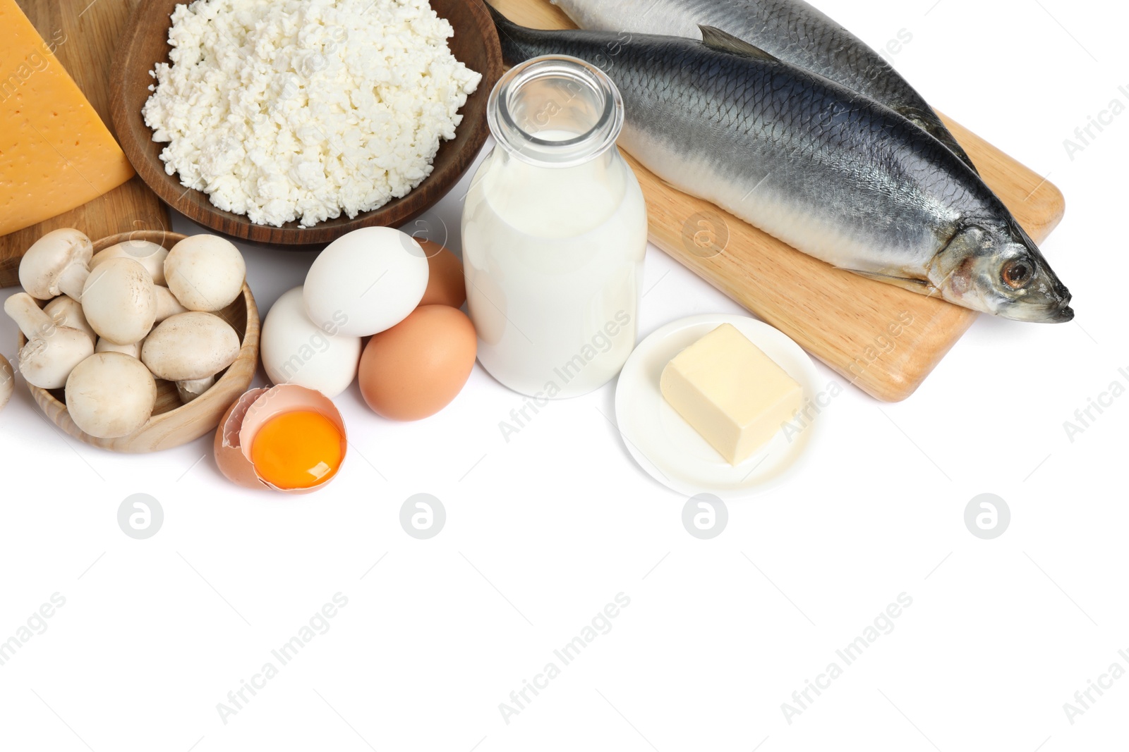 Photo of Fresh products rich in vitamin D on white background