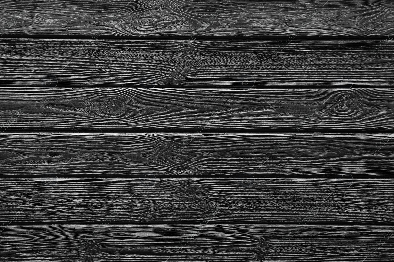 Photo of Texture of black wooden surface as background, top view