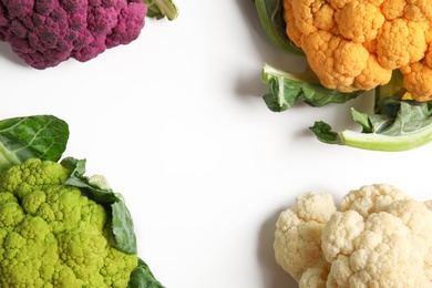 Colorful cauliflower cabbages on white background. Healthy food