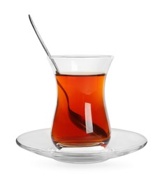 Photo of Glass of traditional Turkish tea with spoon isolated on white