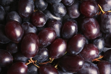 Fresh ripe juicy grapes as background, closeup