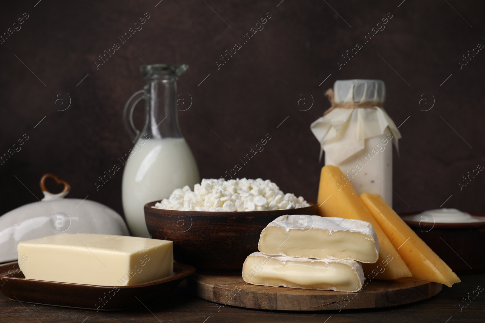 Photo of Different fresh dairy products on wooden table