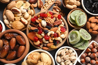 Photo of Flat lay composition of different dried fruits and nuts on table