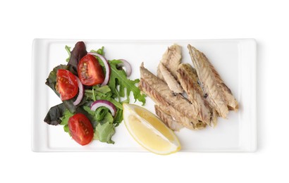 Photo of Plate with delicious canned mackerel fillets, lemon and salad on white background, top view