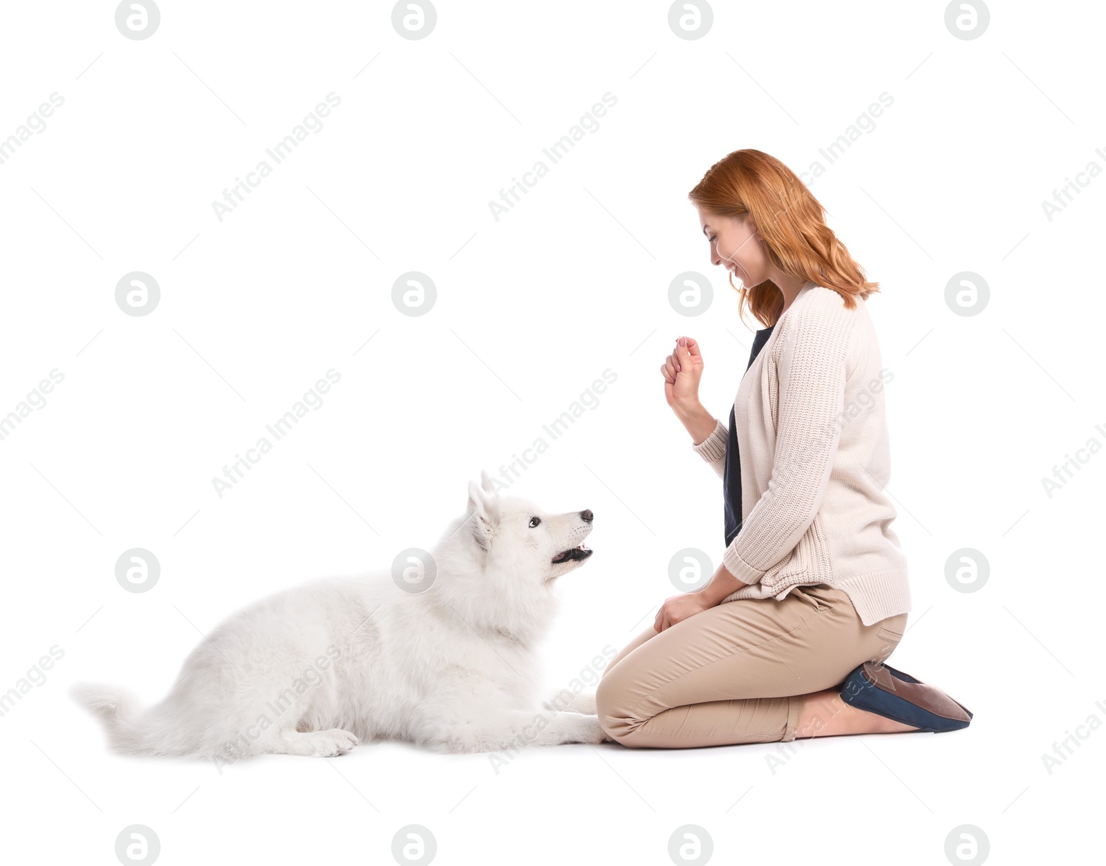 Photo of Beautiful woman with her cute dog on white background