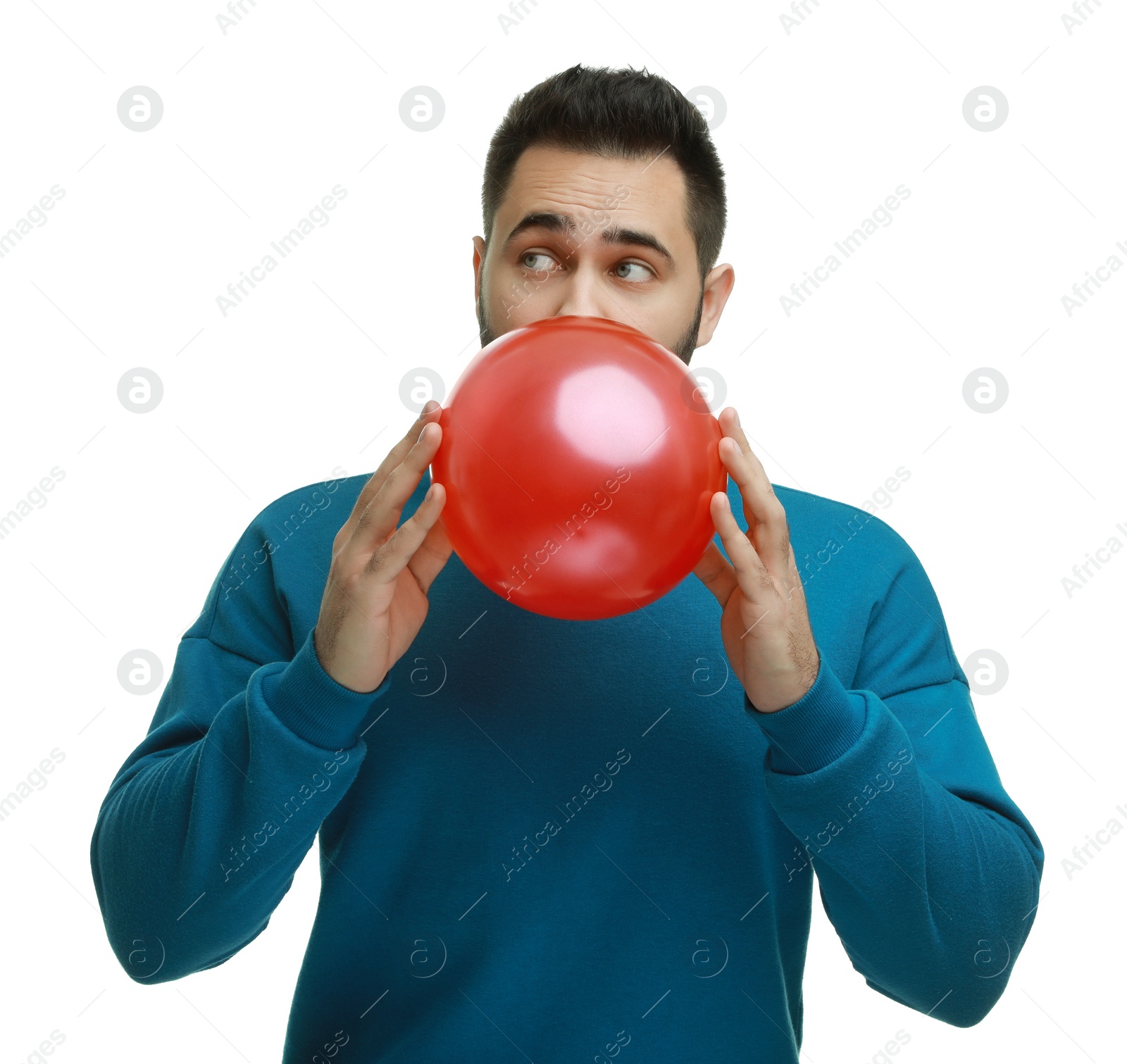 Photo of Man inflating bright balloon on white background