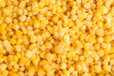 Photo of Frozen corn as background, top view. Vegetable preservation