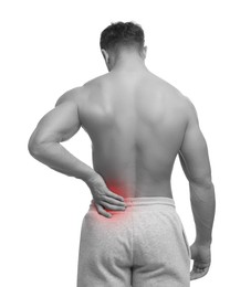 Image of Man suffering from back pain on white background. Black and white effect with red accent