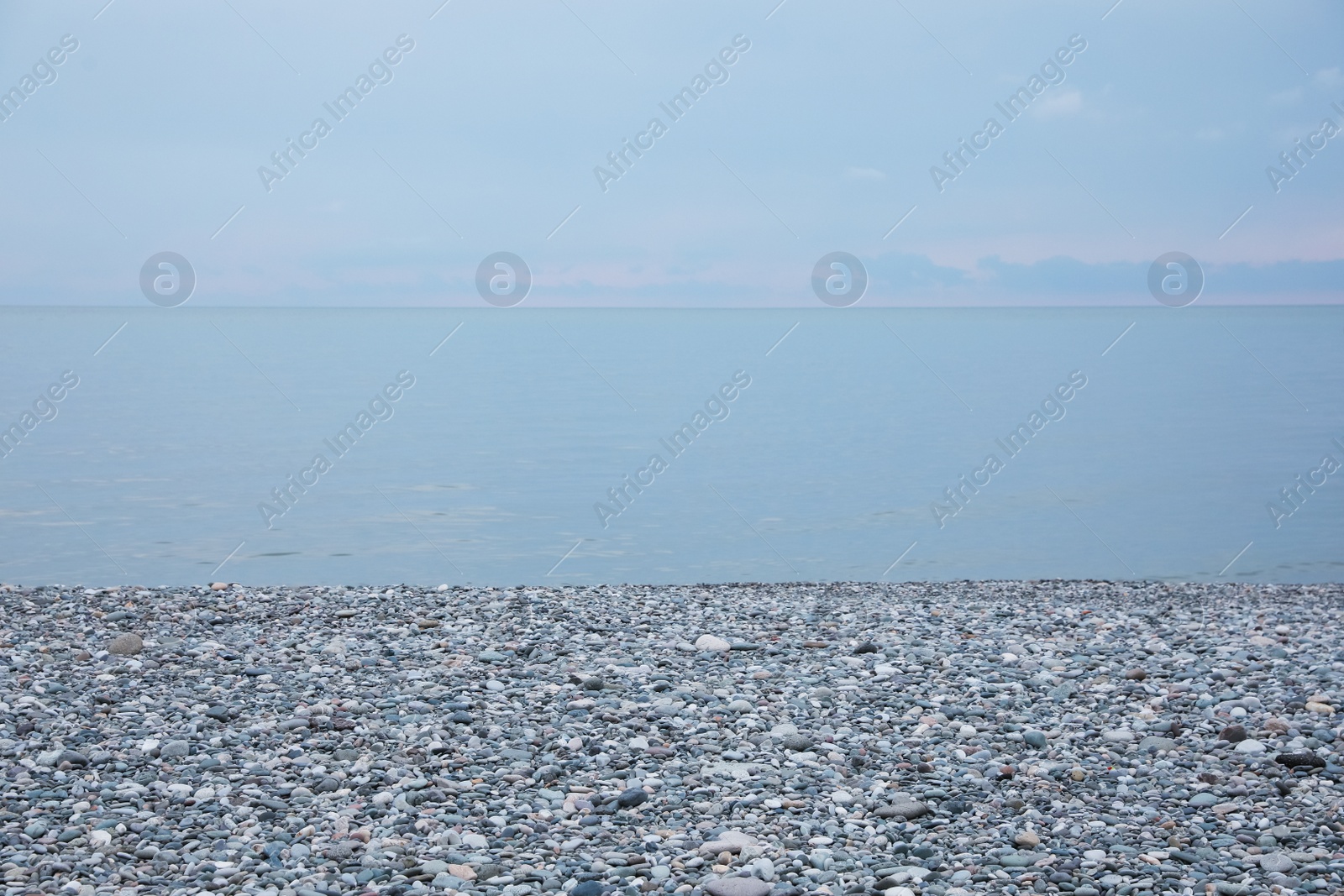 Photo of Picturesque view of beach with pebbles near sea