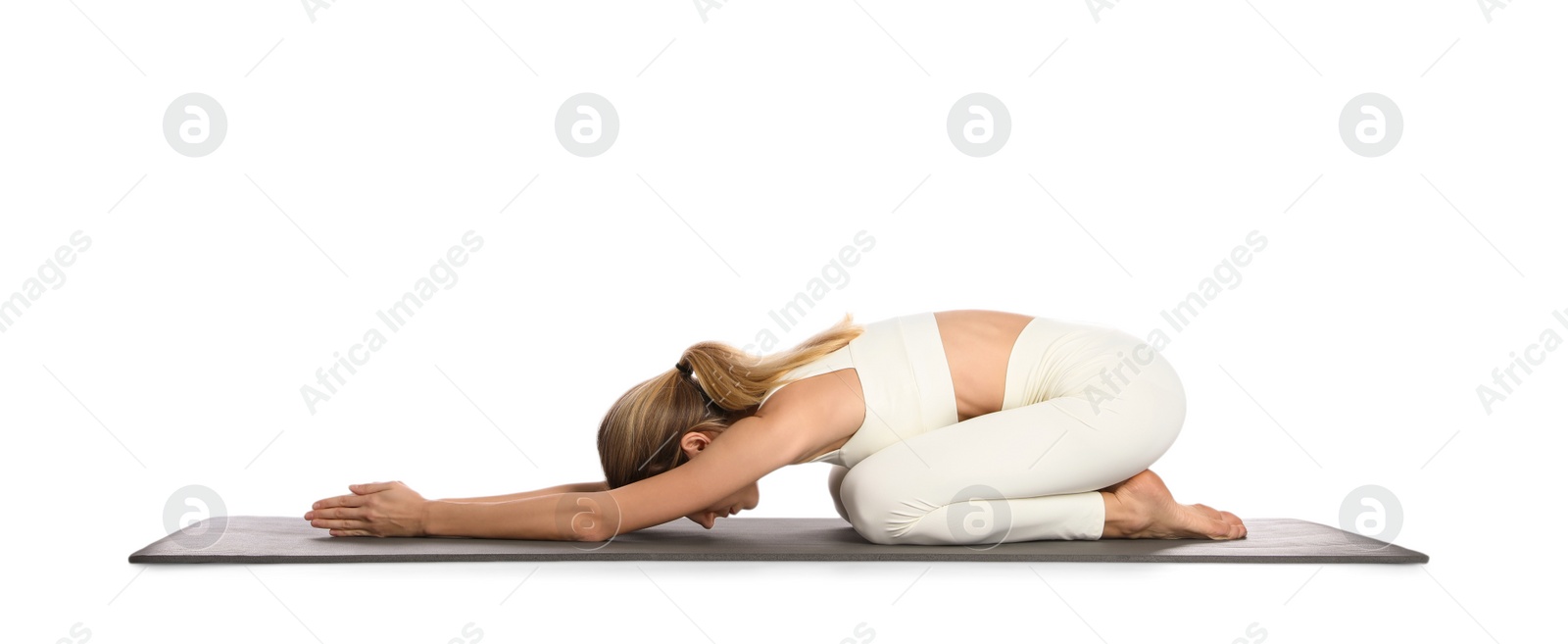 Photo of Young woman in sportswear practicing yoga on white background