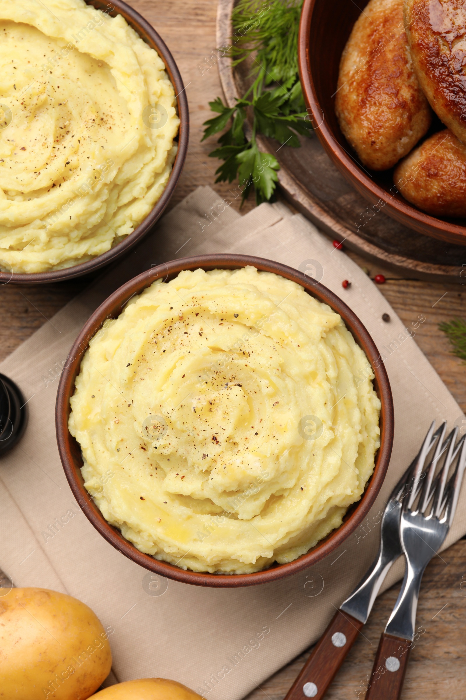 Photo of Flat lay composition with tasty mashed potatoes on wooden table