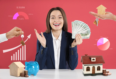 Excited woman with money and house models at table against pink background. Real estate agent