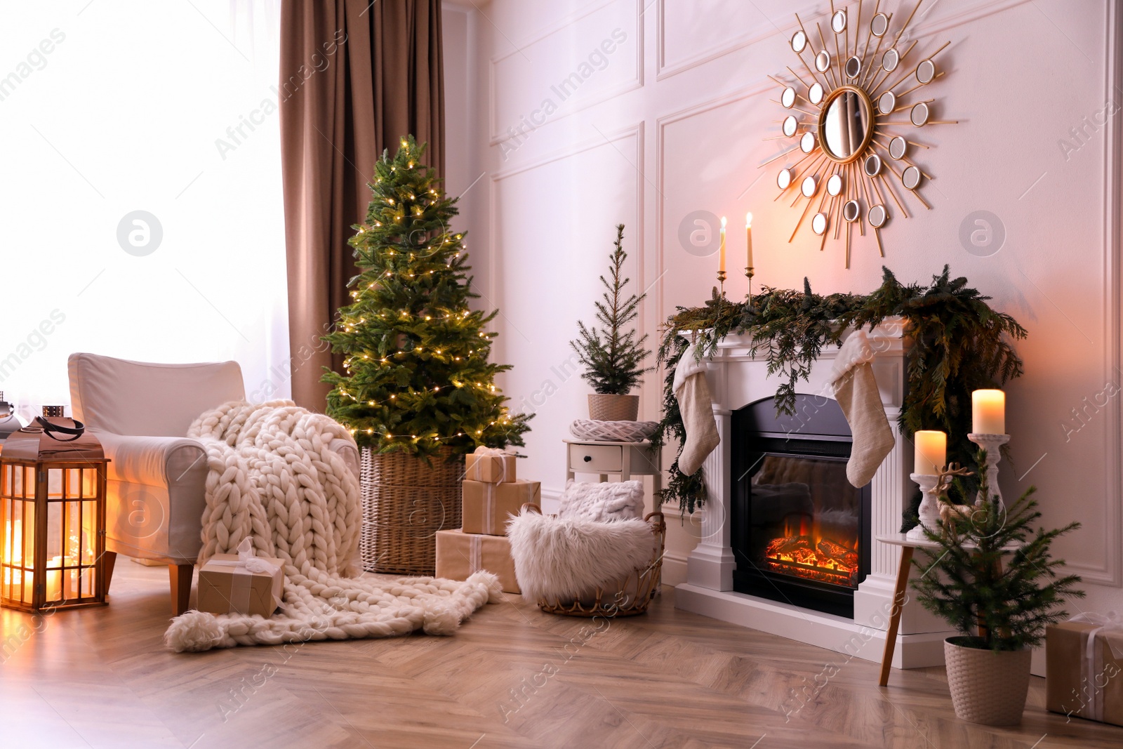 Photo of Stylish room interior with fireplace and beautiful Christmas tree