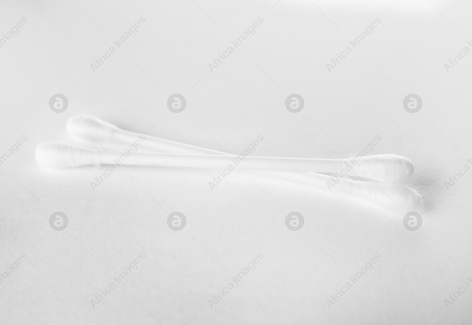 Photo of Clean cotton buds on white background. Hygienic accessory