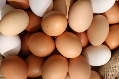 Fresh chicken eggs as background, top view