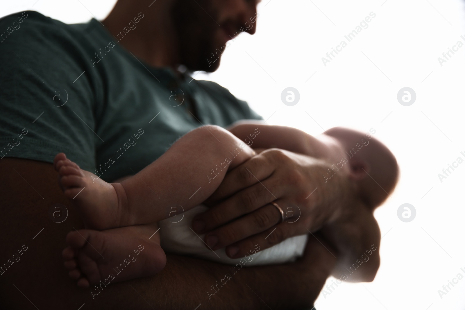 Image of Father with his newborn baby on white background, closeup