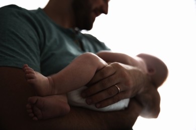 Image of Father with his newborn baby on white background, closeup