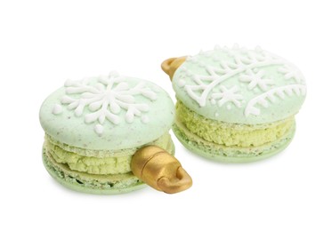 Photo of Beautifully decorated Christmas macarons on white background