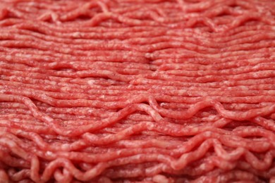 Photo of Fresh raw ground meat as background, closeup