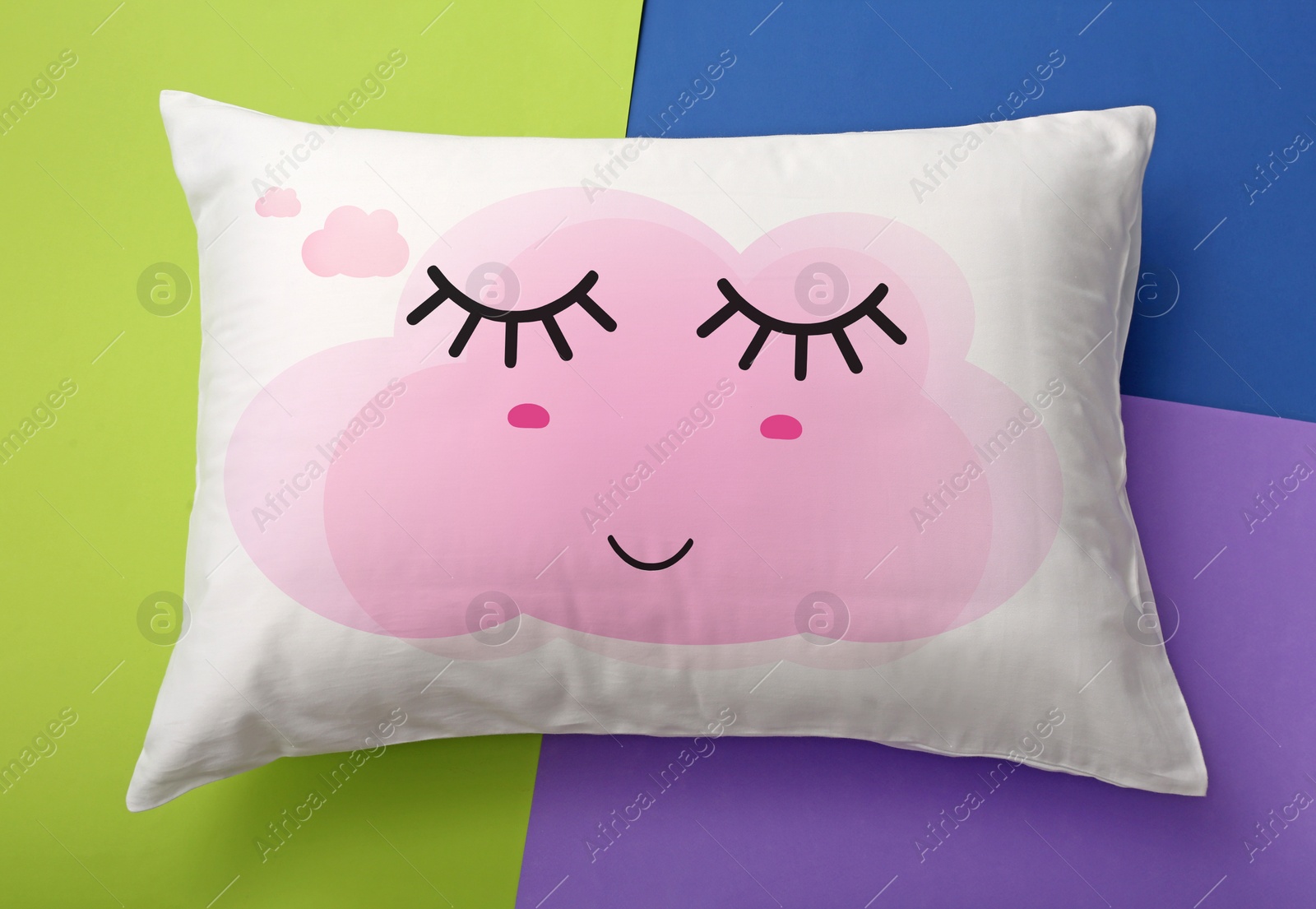 Image of Soft pillow with cute face on color background, top view