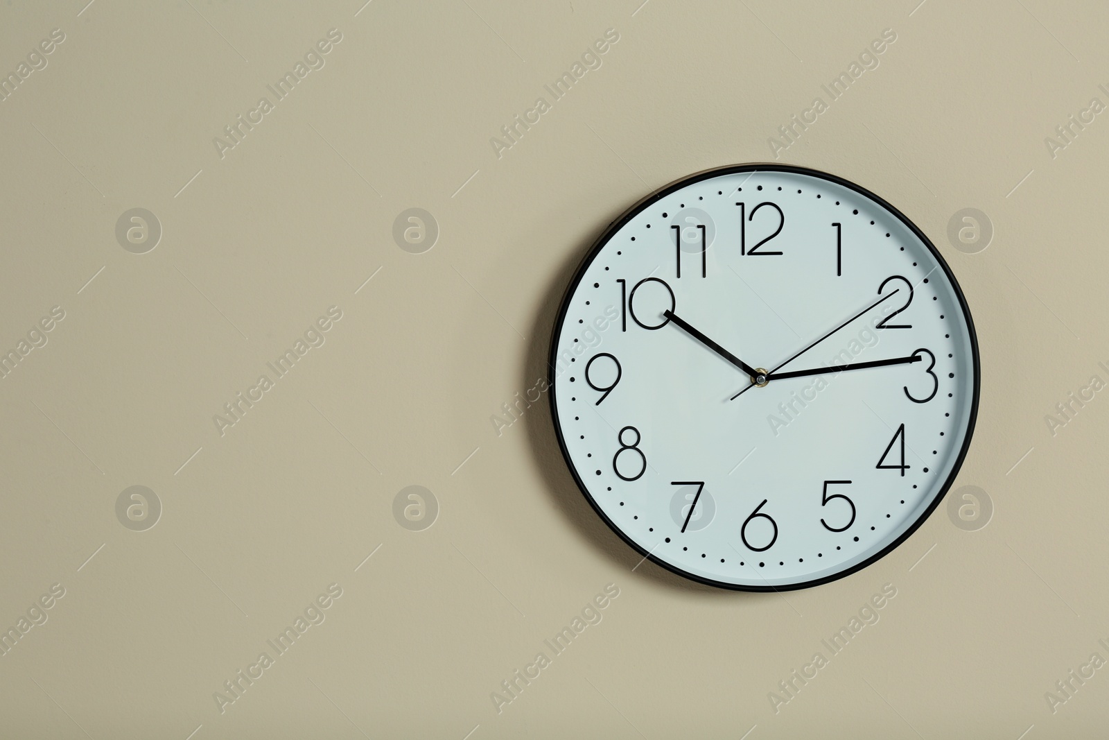 Photo of Stylish clock and space for text on color background. Time management