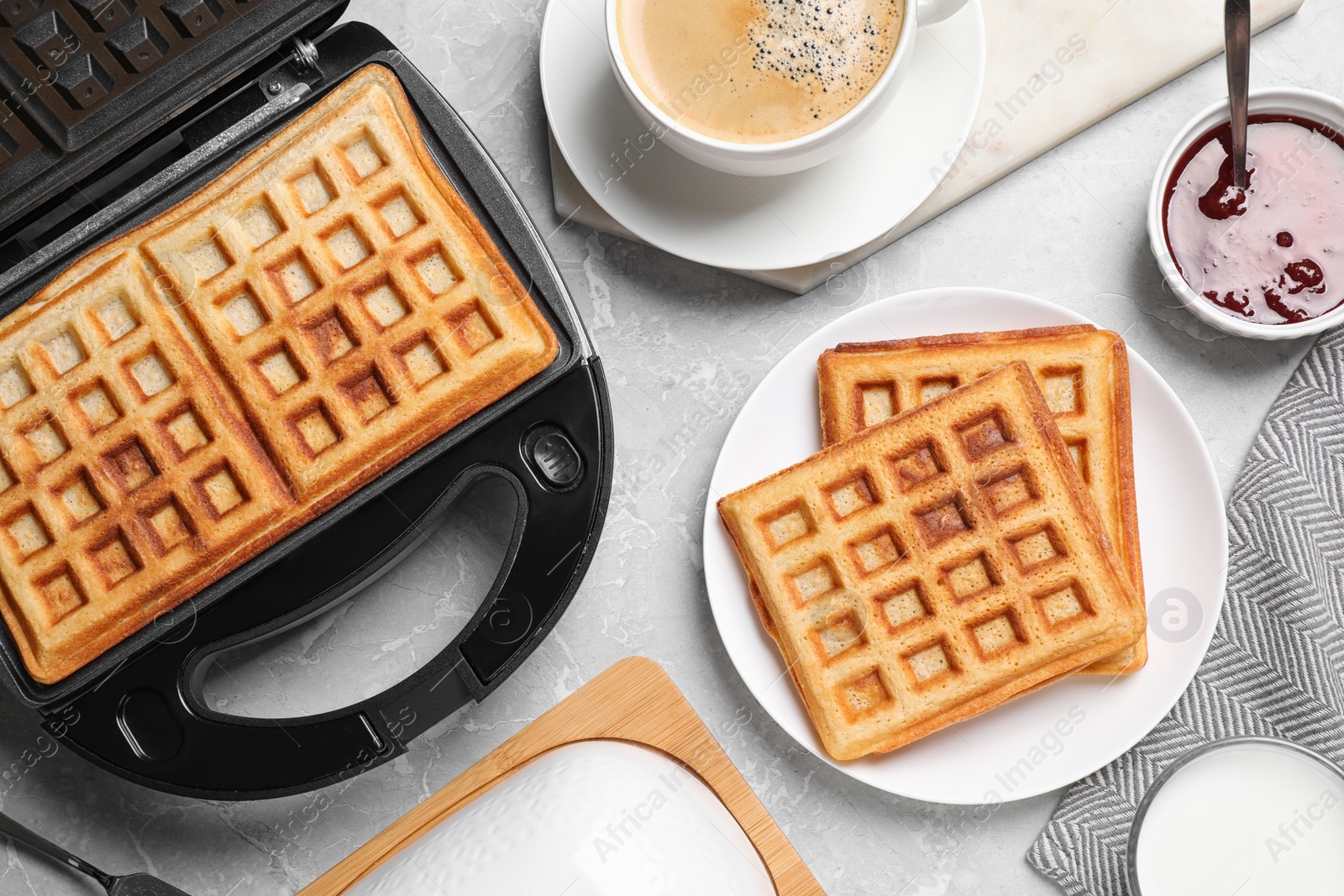 Photo of Flat lay composition with fresh Belgian waffles on light grey marble table