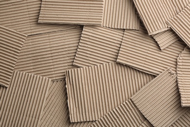 Photo of Pieces of cardboard as background, top view. Recycling concept