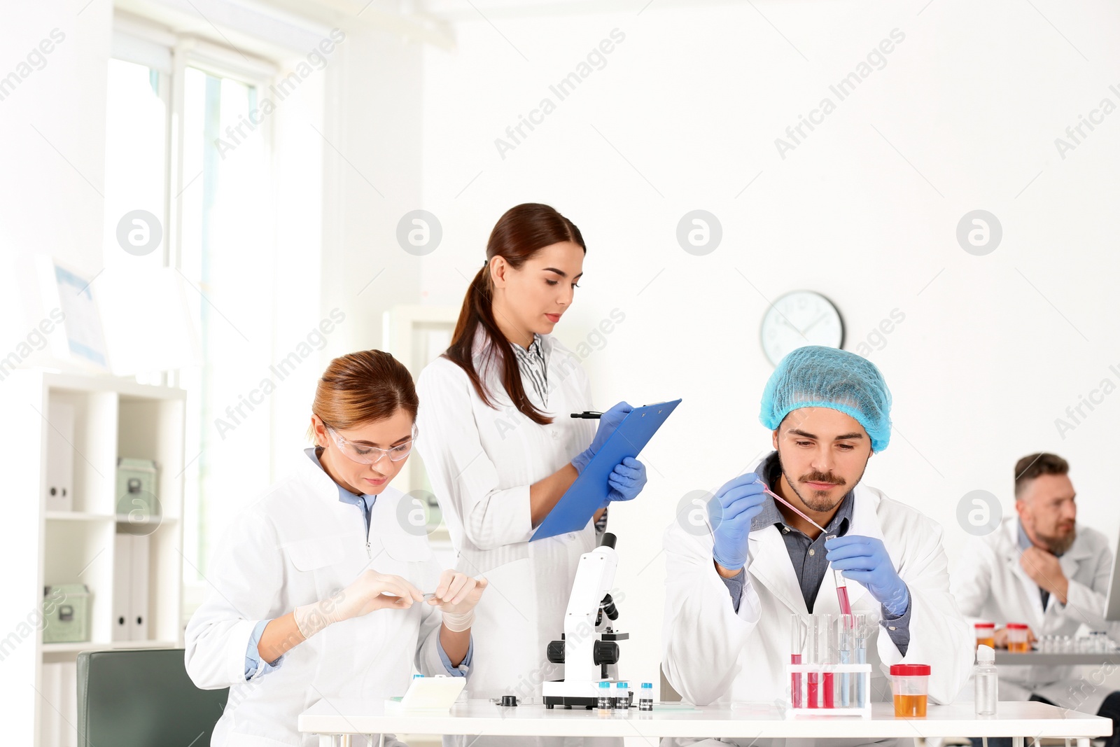 Photo of Scientists working in laboratory. Research and analysis