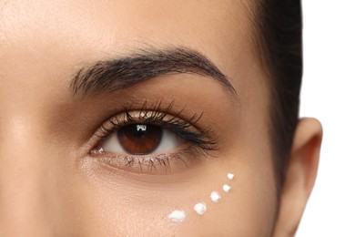 Photo of Woman with eye cream on white background, closeup. Skin care