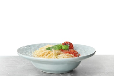 Photo of Tasty pasta on light grey marble table against white background