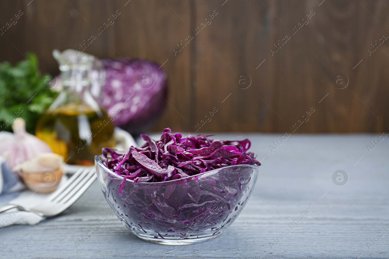 Photo of Tasty red cabbage sauerkraut on light grey wooden table