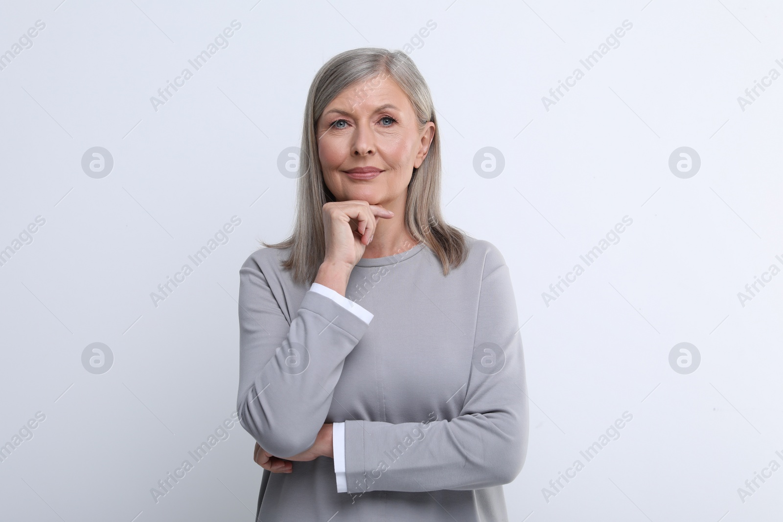 Photo of Portrait of beautiful senior woman on white background