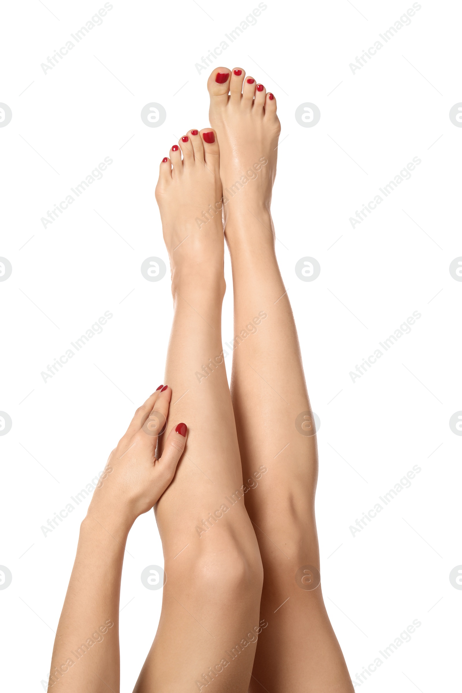 Photo of Woman with stylish red toenails after pedicure procedure isolated on white, closeup