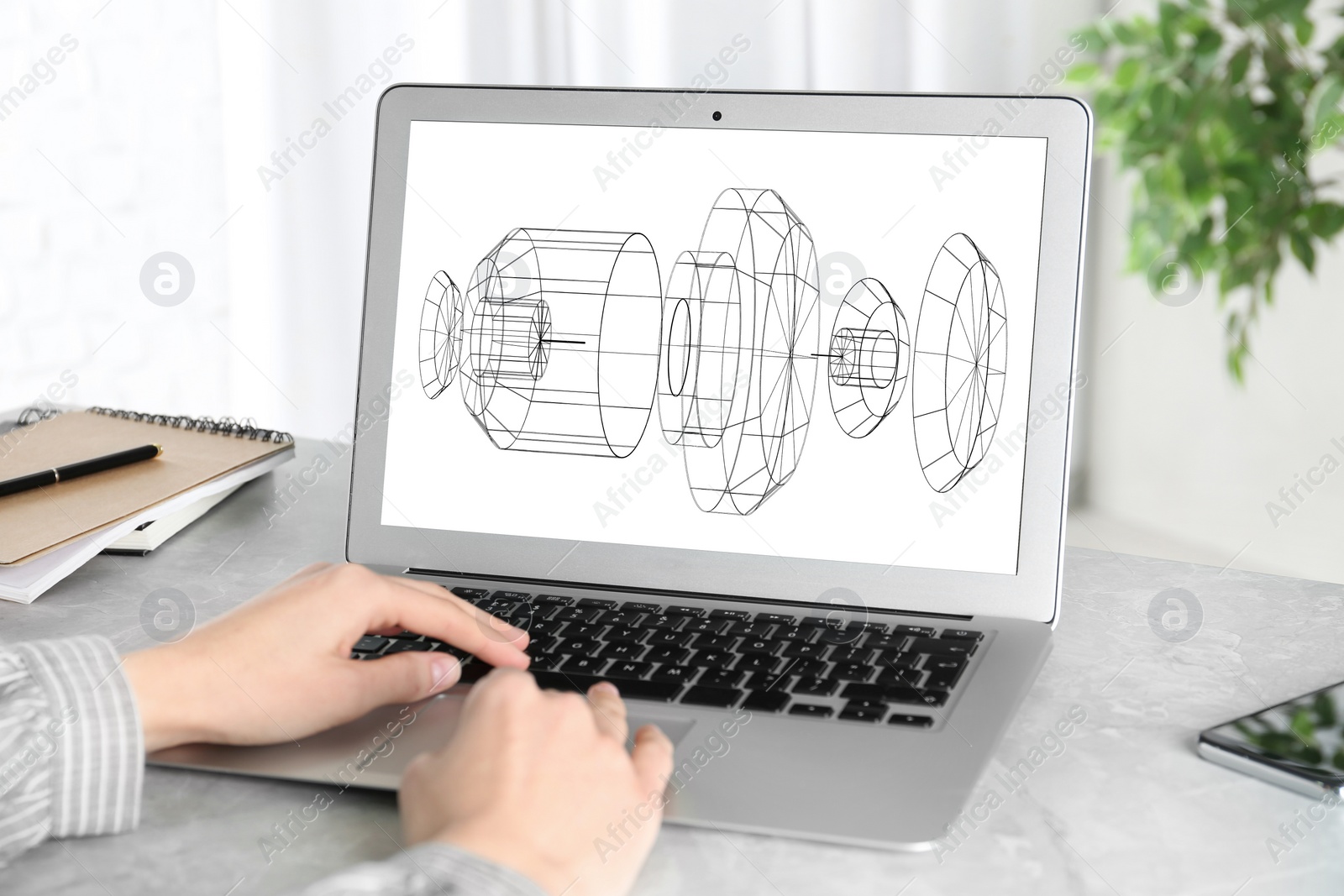 Image of Female engineer working with 3d model of modern equipment on laptop indoors, closeup