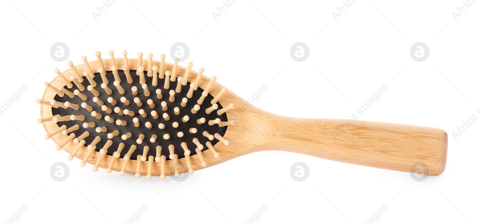 Photo of One new wooden hairbrush isolated on white