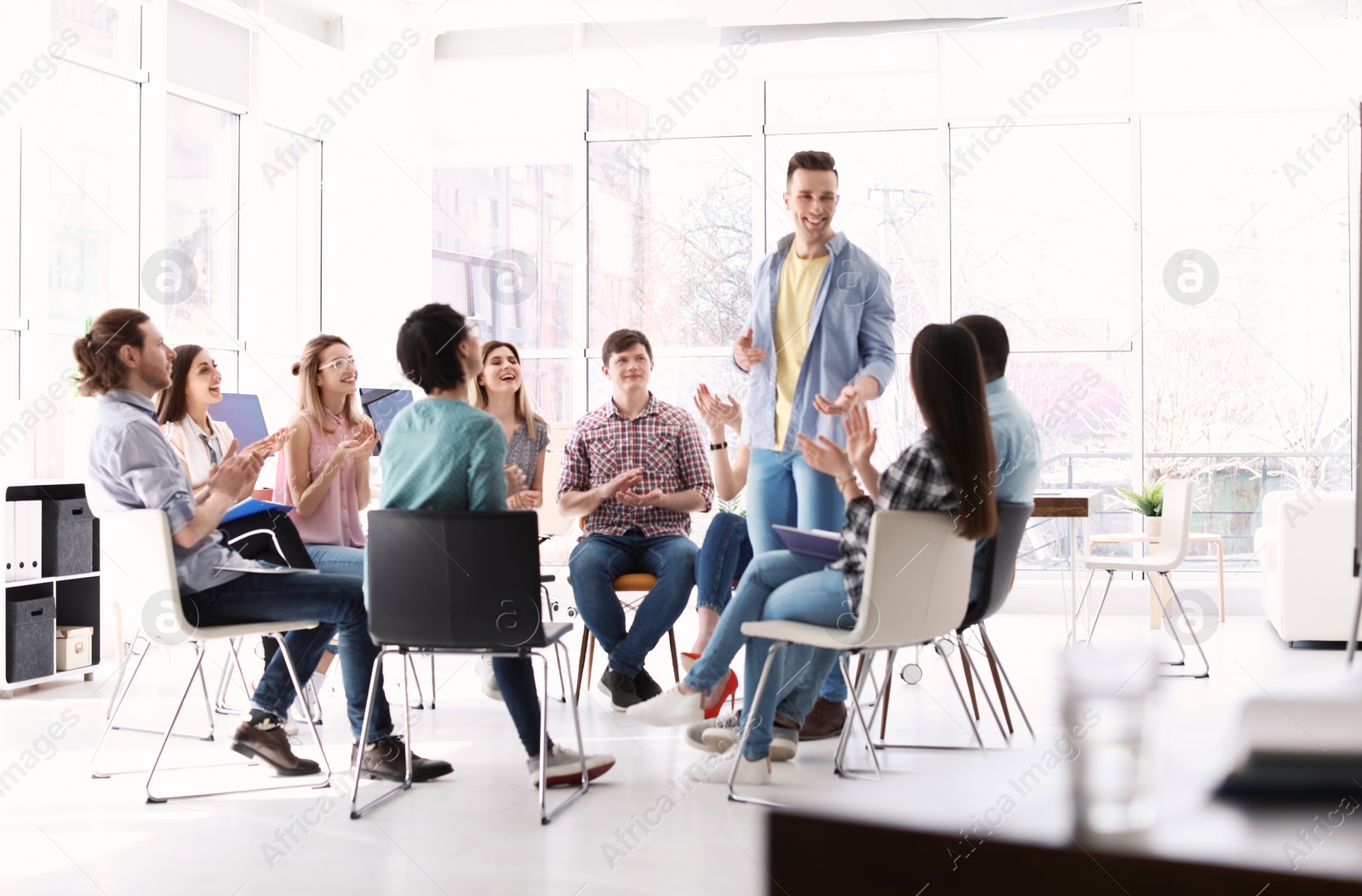 Photo of Male business trainer giving lecture in office