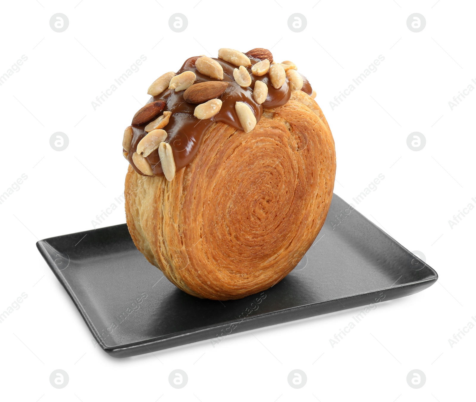 Photo of Round croissant with chocolate paste and nuts isolated on white. Tasty puff pastry