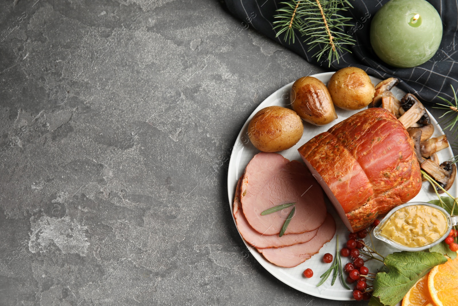 Photo of Flat lay composition with delicious ham on grey table, space for text. Christmas dinner