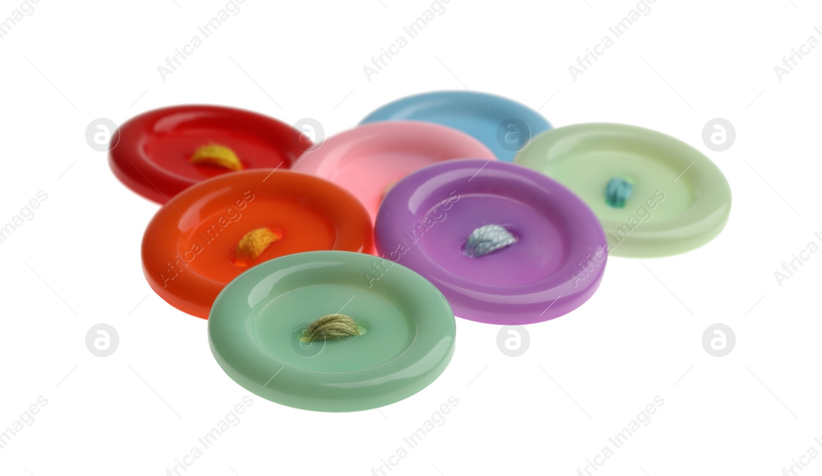 Photo of Many colorful sewing buttons on white background