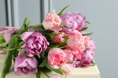 Beautiful bouquet of colorful tulip flowers on table