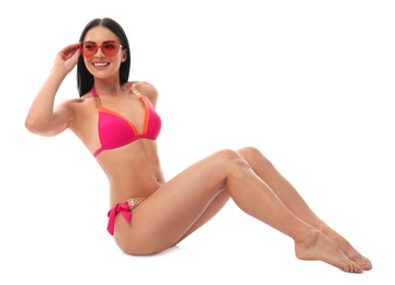 Photo of Beautiful young woman in stylish bikini with sunglasses on white background