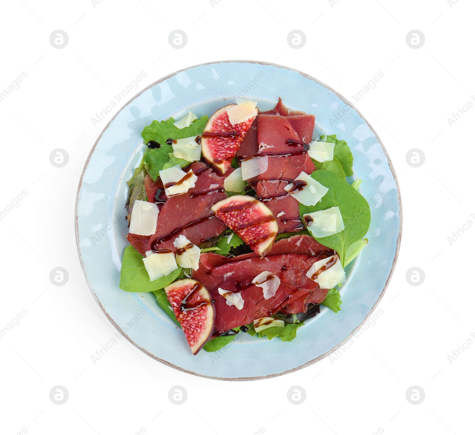 Photo of Plate with delicious bresaola salad isolated on white, top view