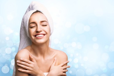 Image of Beautiful young woman with silky skin on light background, space for text. Spa treatment 