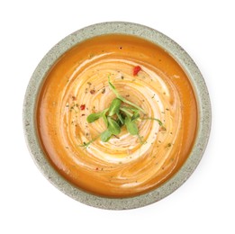 Photo of Delicious pumpkin soup with microgreens in bowl isolated on white, top view