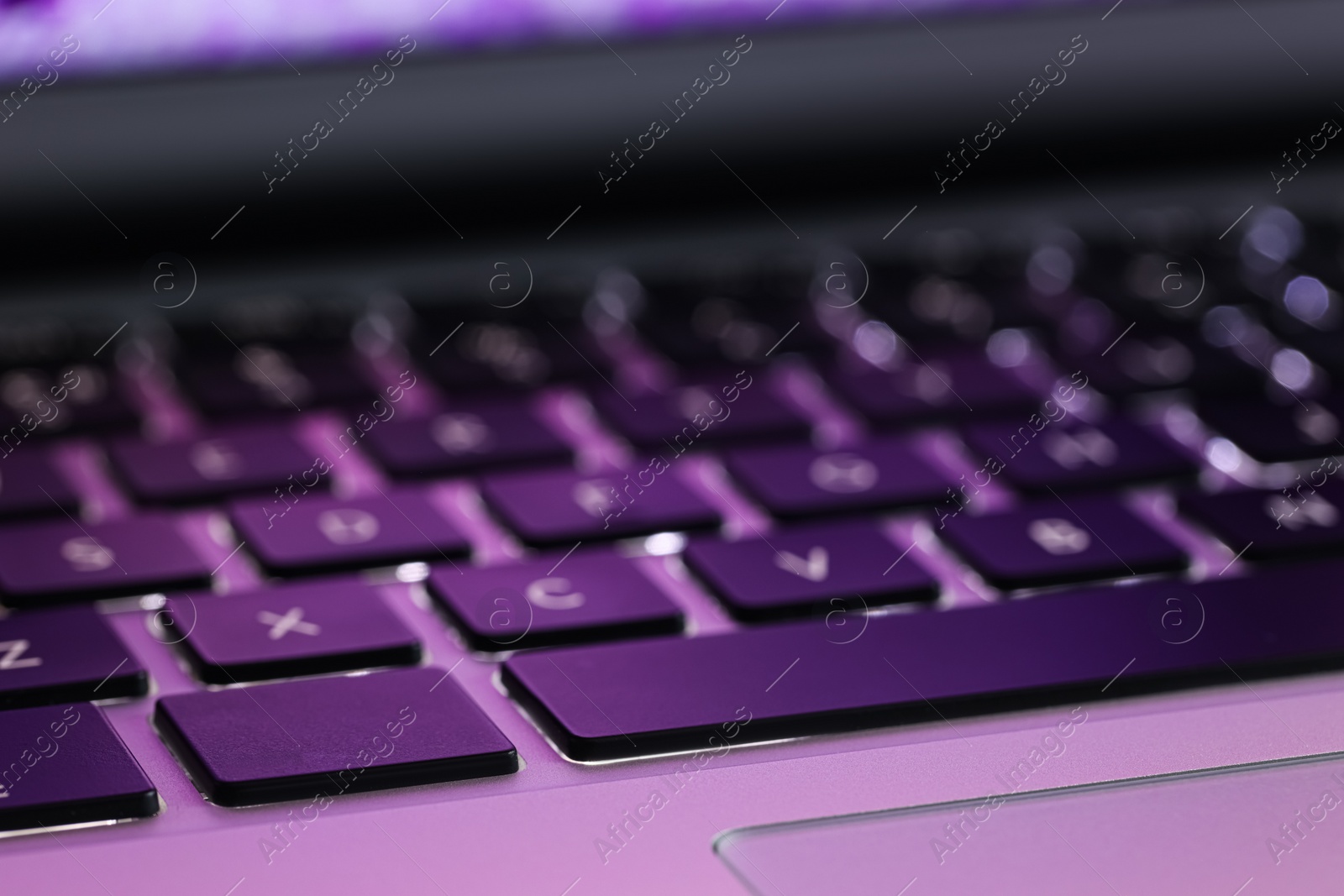 Photo of Closeup view of modern laptop keyboard as background