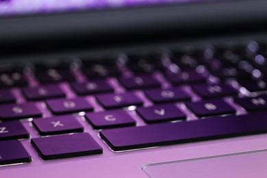 Closeup view of modern laptop keyboard as background