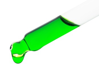 Photo of Dripping green facial serum from pipette on white background, closeup