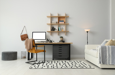 Photo of Stylish room interior with modern comfortable workplace